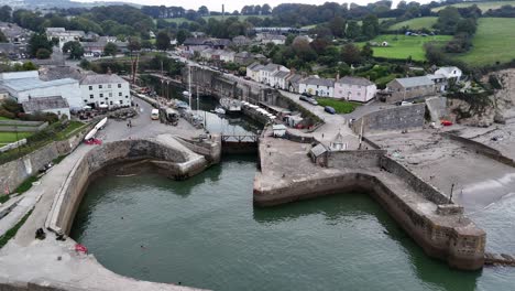 Charlestown-Cornwall-UK-Historic-harbour-pull-back-drone-aerial-reverse-reveal