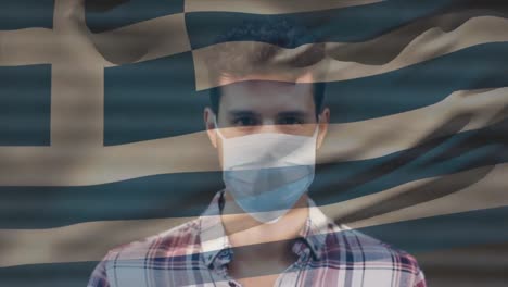 Animation-of-flag-of-greece-waving-over-man-wearing-face-mask-during-covid-19-pandemic