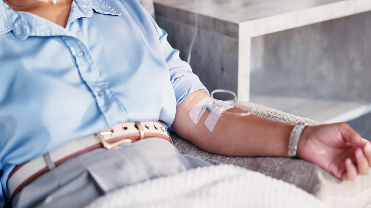 Close-up of Patient's Arm Receiving IV Drip