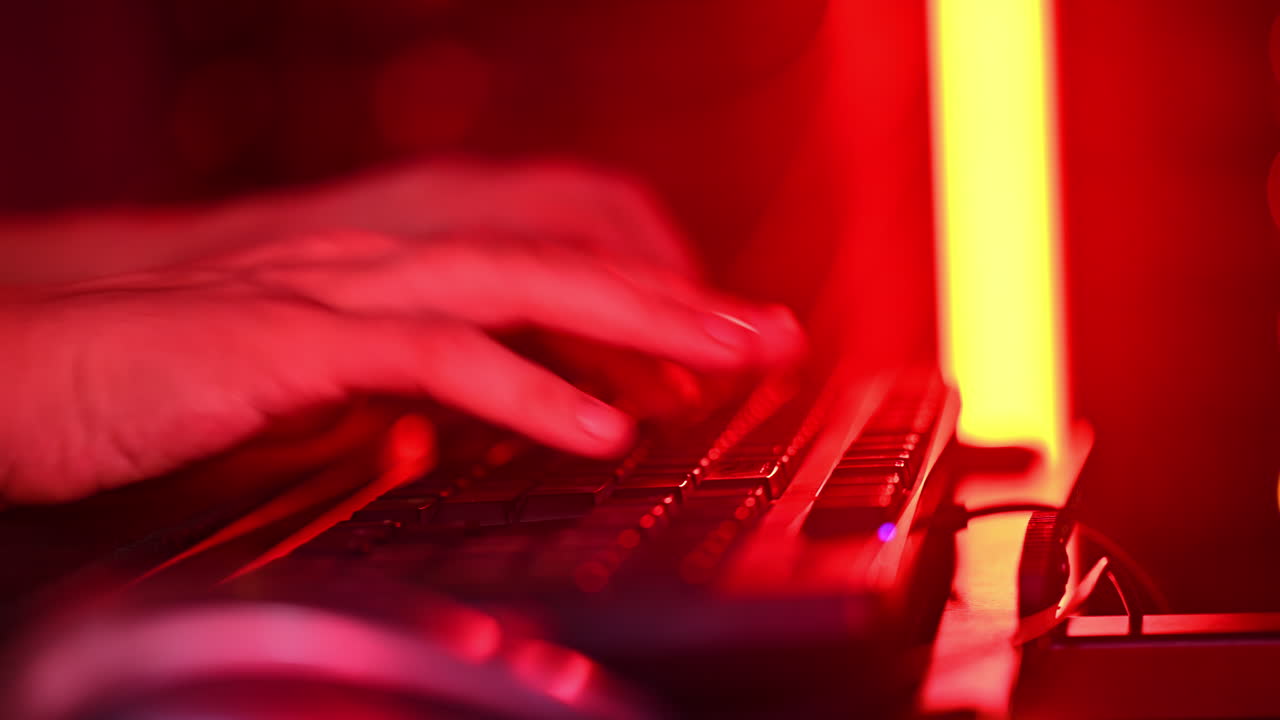 Close up of a man trying to fix an error on a computer in a server room