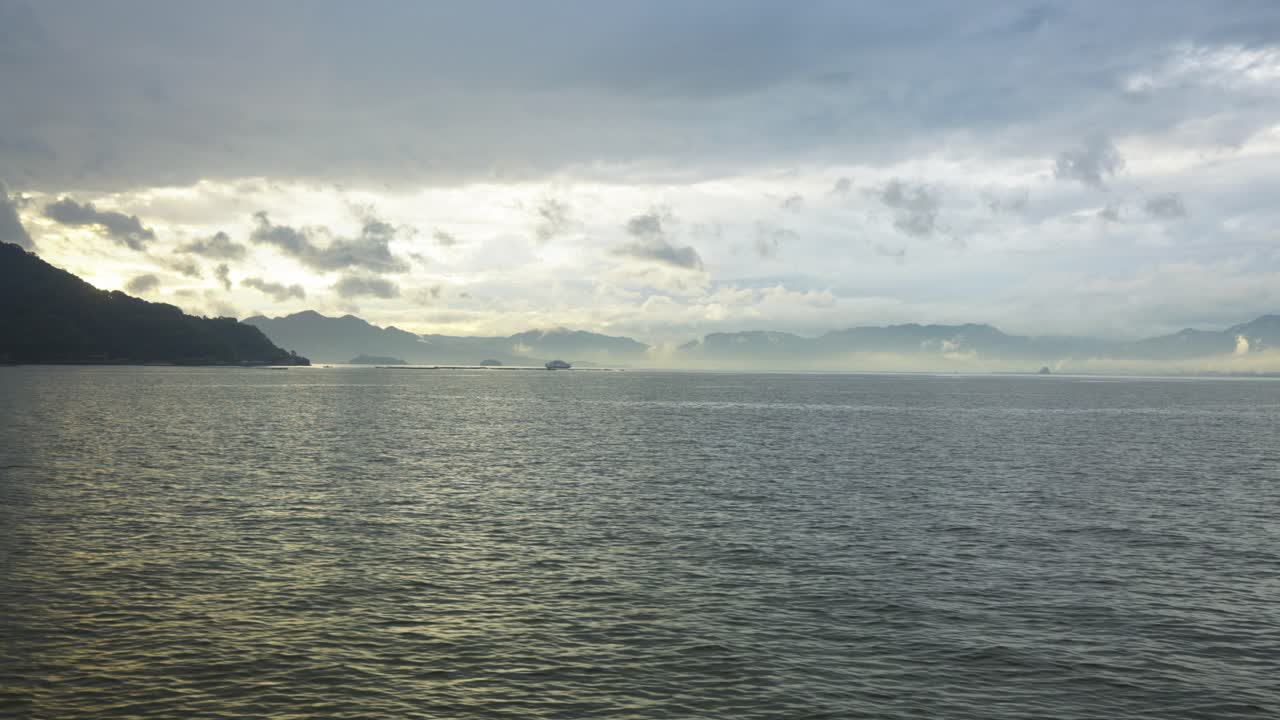 Hiroshima Bay with Clouds and Mist Near Miyajima, Japan Ferry Point of View