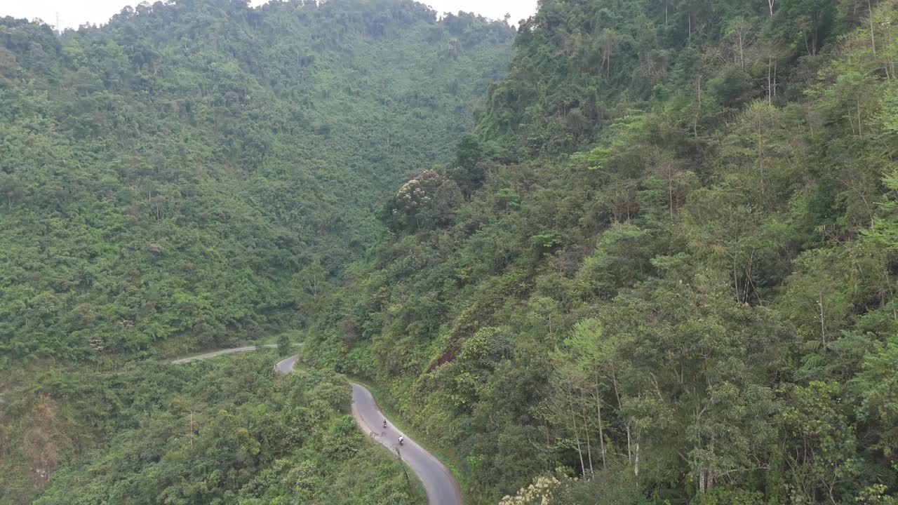 Soar over a beautiful river that winds through a canyon in Ha Giang’s thick jungle. Experience the stunning natural beauty of Vietnam’s rugged wilderness from above.