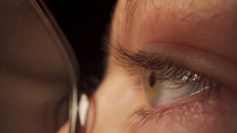 Extreme-close-up-of-a-women's-eye-with-glasses-on-using-a-probe-lens