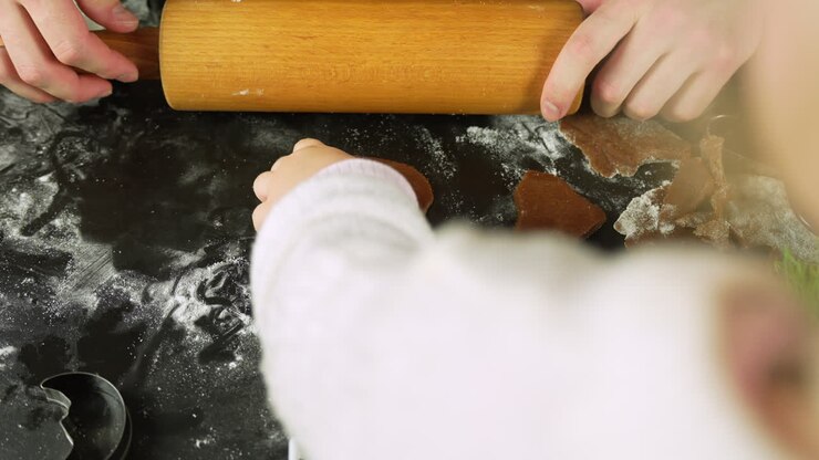 Mom And Daughter Making Gingerbread Cookies - Close Up