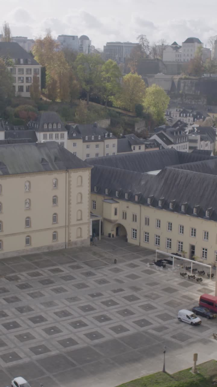 Aerial view of Prague courtyard with parked cars and classic architecture