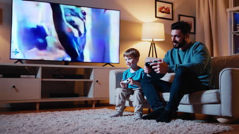 father and son gaming session in living room