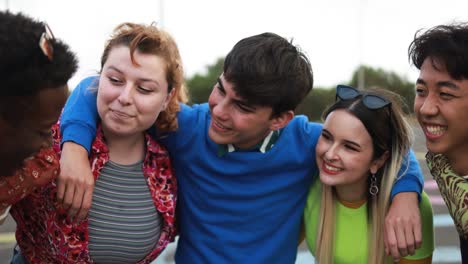 young diverse people having fun outdoor laughing together