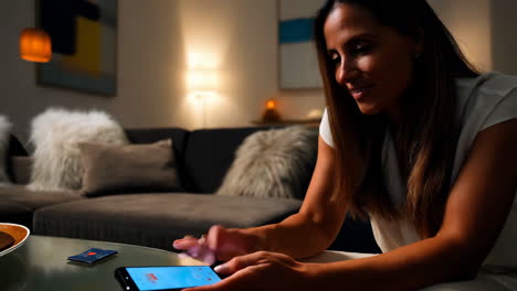 woman using a smartphone in a living room