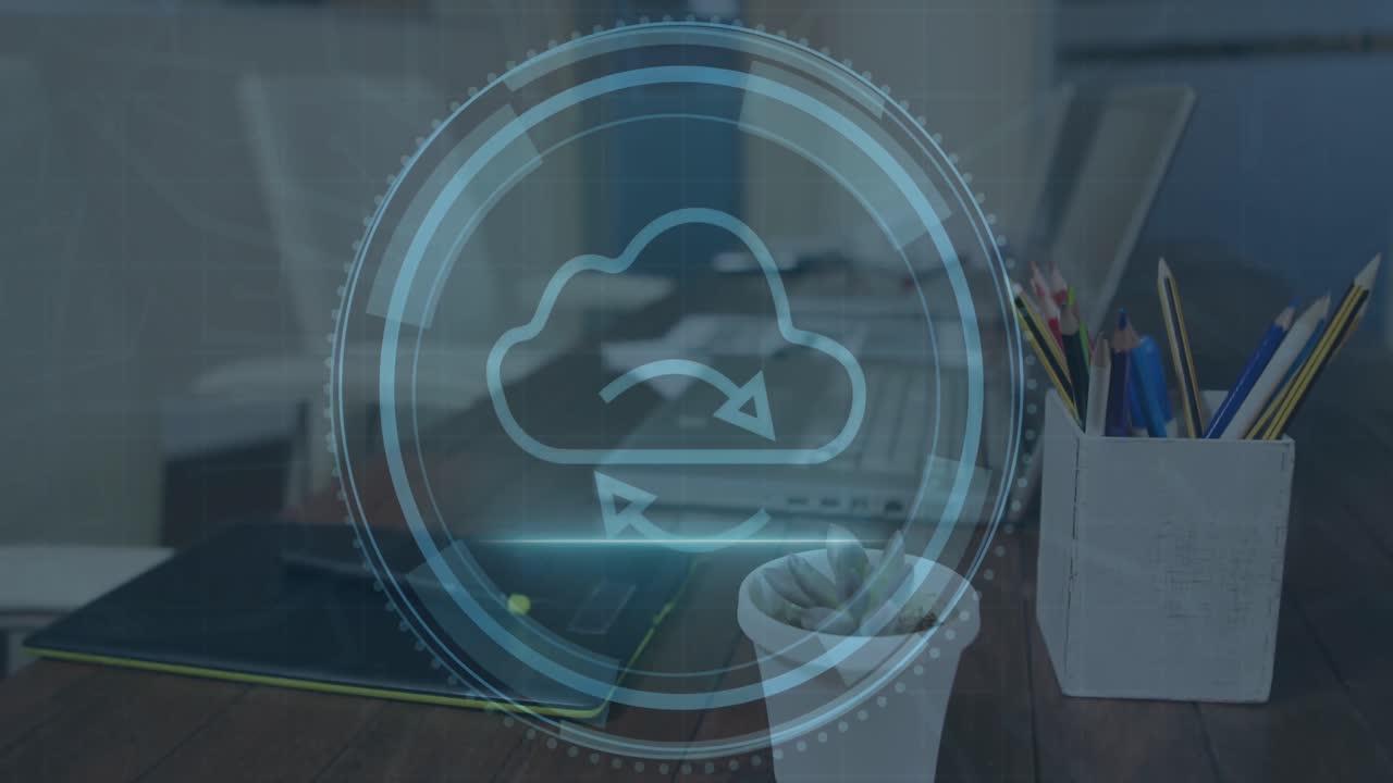 Animation of cloud icon over data processing and laptop