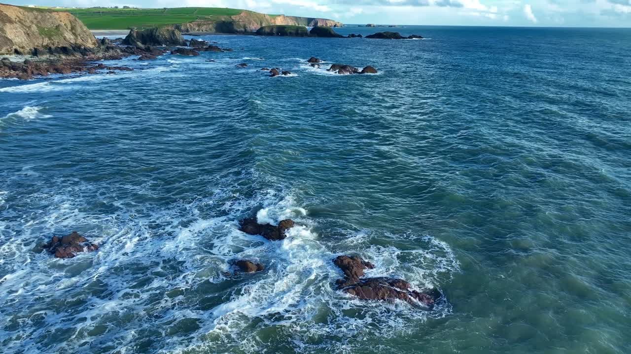swirling seas and incoming waves on submerged rocks Copper Coast Waterford Ireland Epic Locations in autumn