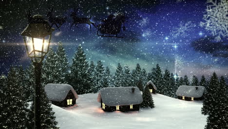 snowflakes falling over houses and trees on winter landscape against shining stars in night sky