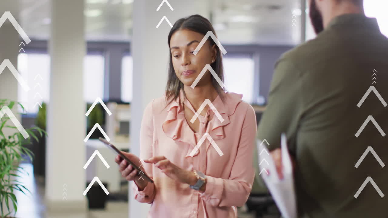Animation of arrows and data processing over diverse business people in office