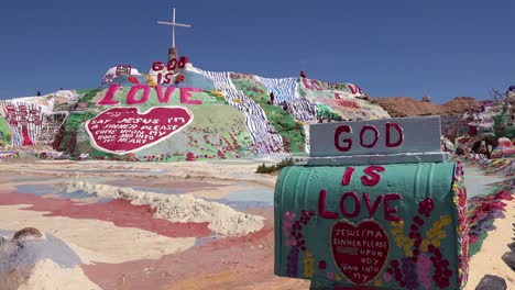 a giant hippy christian art installation honors jesus in the desert in slab city california