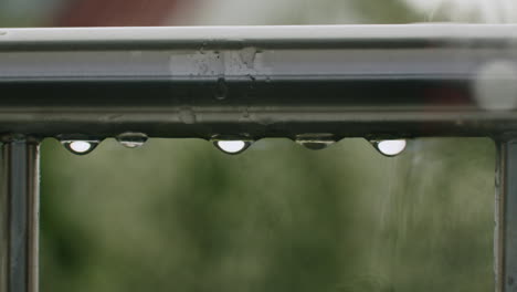 rain falling on railing – german suburban balcony scene in overcast weather
