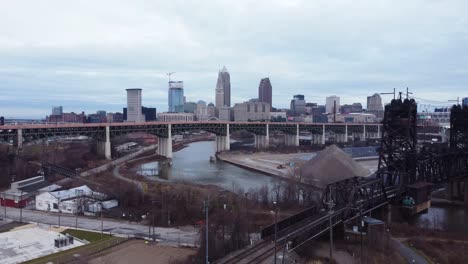 Drone-shot-of-downtown-Cleveland-pulling-out-to-reveal-the-Cleveland-sign