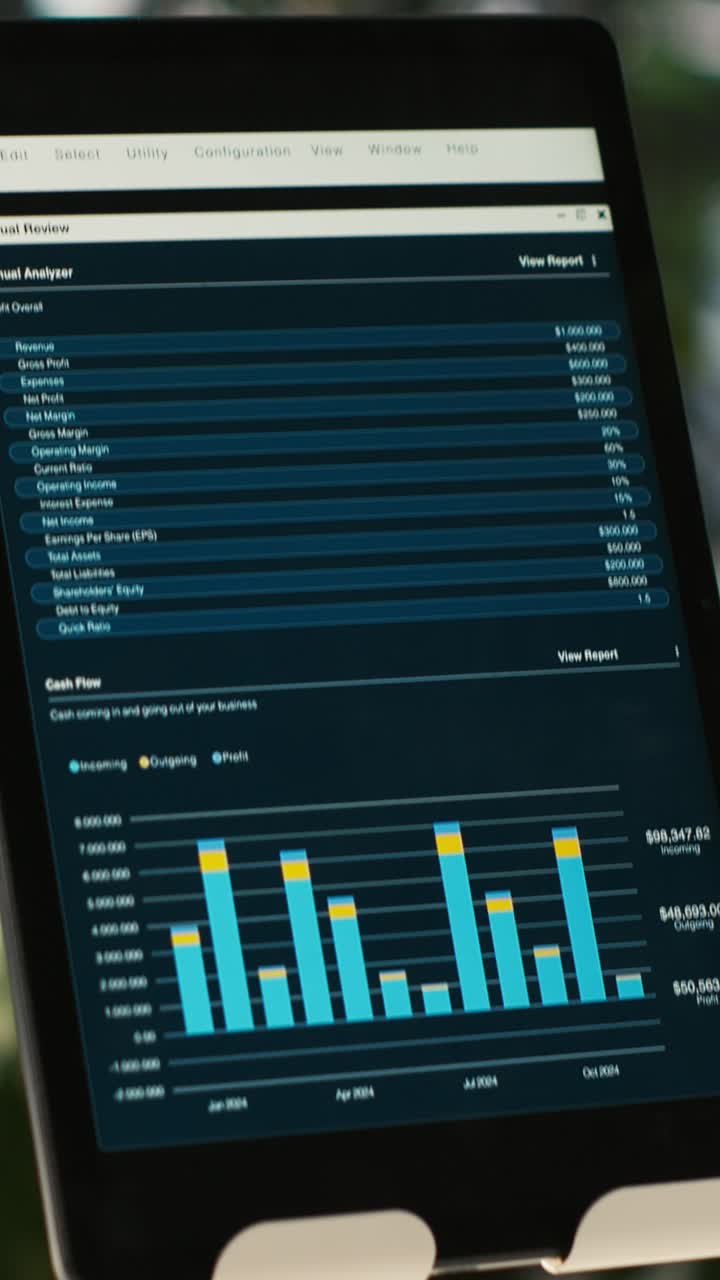 Vertical video Close up of tablet screen on desk displaying financial graphs