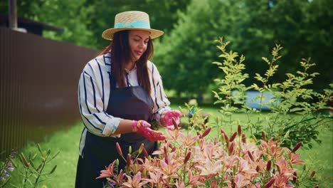 woman in straw hat tending to vibrant flowers in a lush garden, enjoying nature's beauty