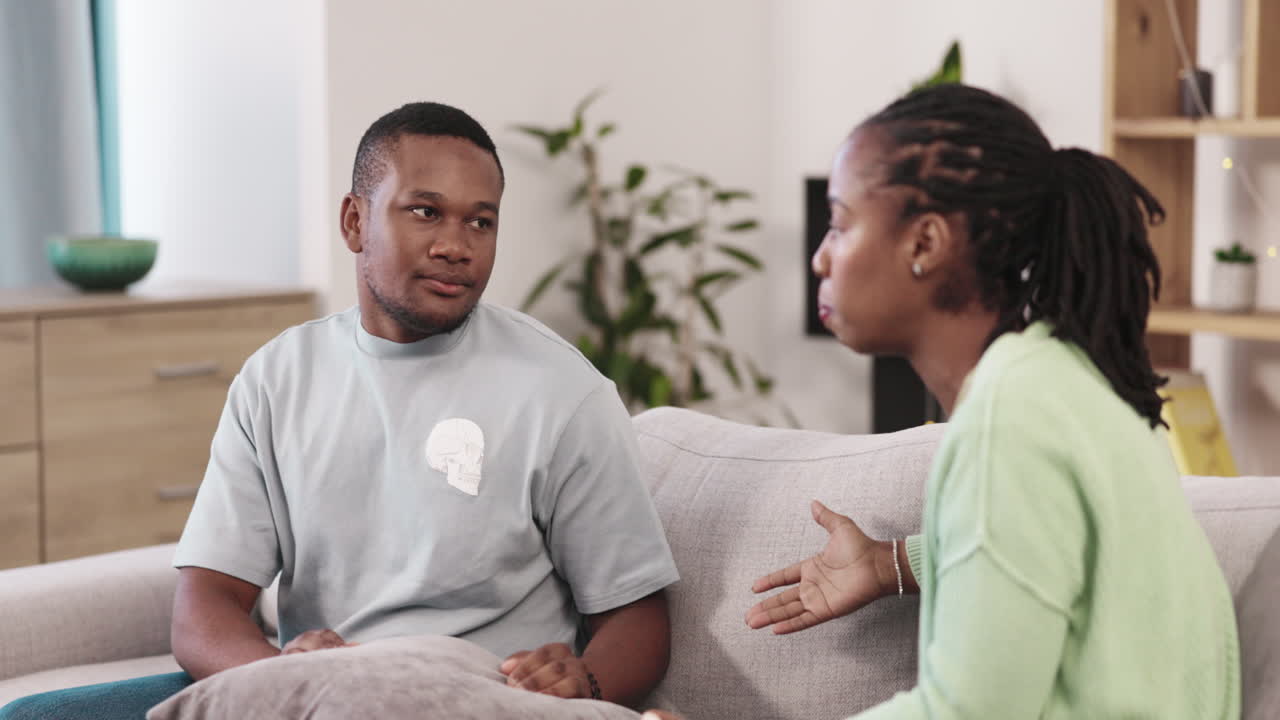 Mad, argument and fight with black couple on sofa