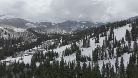 Aerial-orbit-of-ski-run-near-Solitude-Resort-in-Big-Cottonwood-Canyon,-Utah-during-late-spring