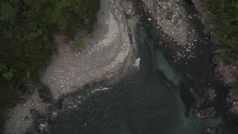 flying over rocky cove on remote yakushima island, japan