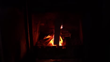 rustic fireplace on a dark old structure