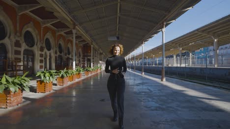 woman walking through a train station