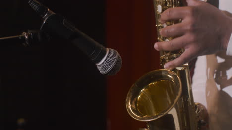 Close-Up-View-Of-Latin-Man-Playing-Sax-During-Live-Music-Perfomance-1