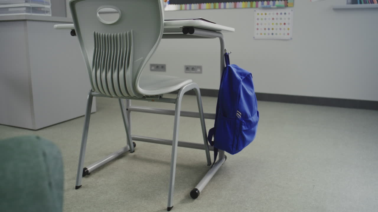 American Elementary School Interior of Empty Classroom with Desks for Students