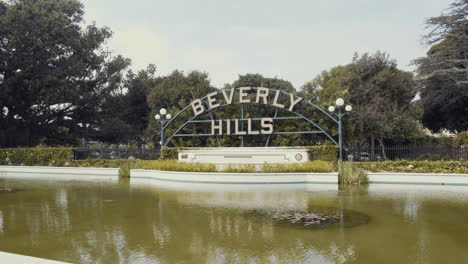 passing by beverly hills sign slow motion los angeles la california ca