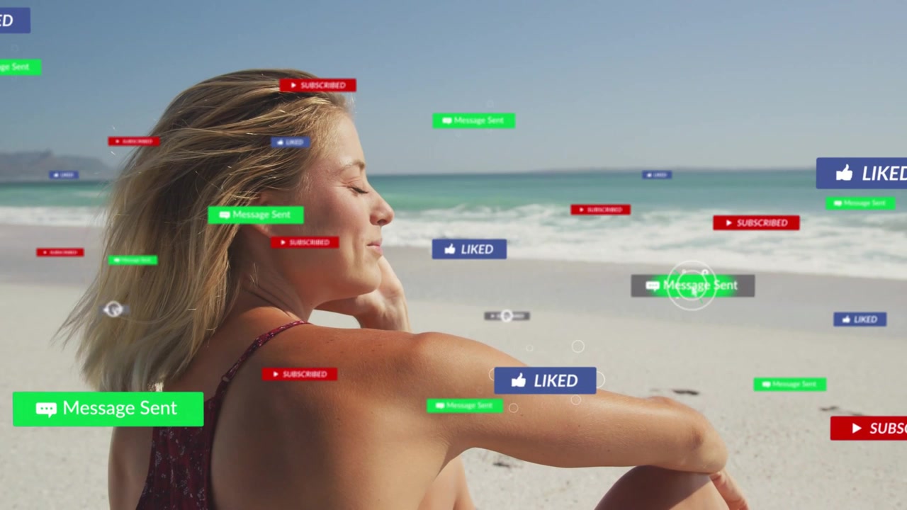 Woman sitting on beach getting floating social media notifications showing engagement, raising hand