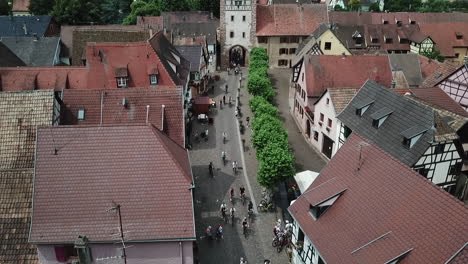 a stationary aerial footage of the main street from the clock tower surrounded by houses