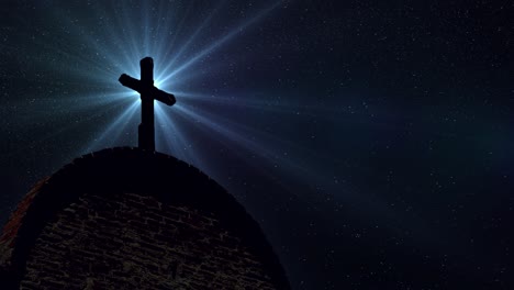 cross silhouette above old building and optical flare rays against star background at night