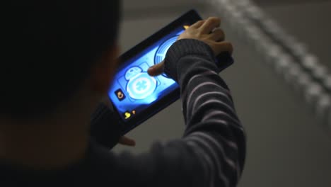 boy gaming with tablet computer. boy playing with tablet computer