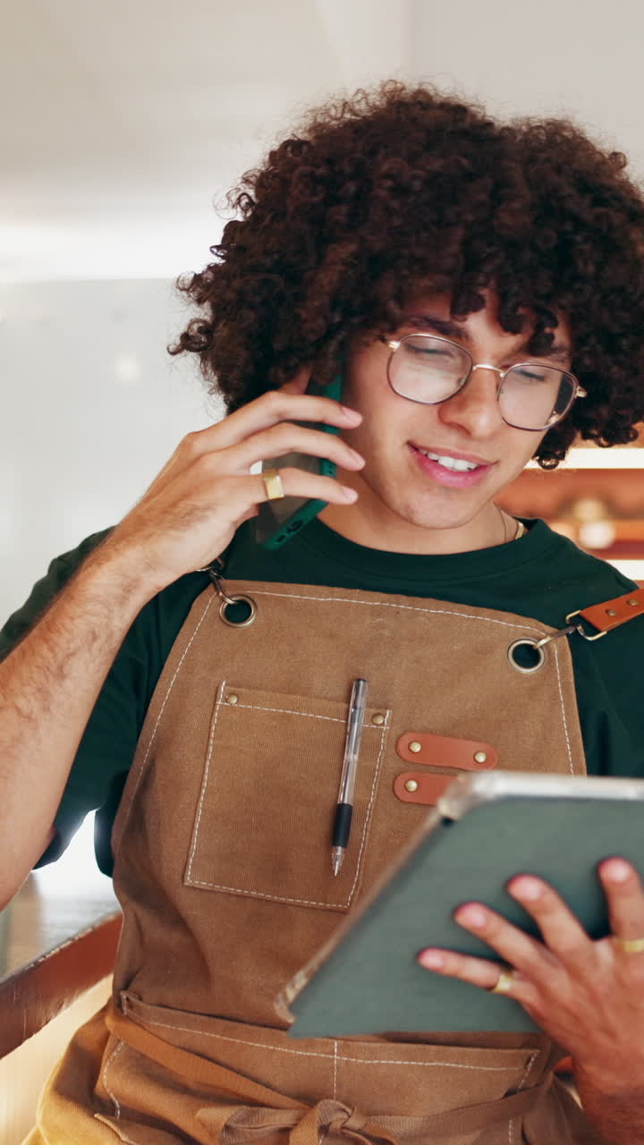 Man in apron talking on phone