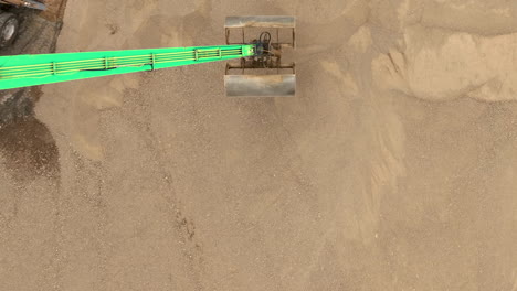 above view of long reach excavator, backhoe machinery in construction site