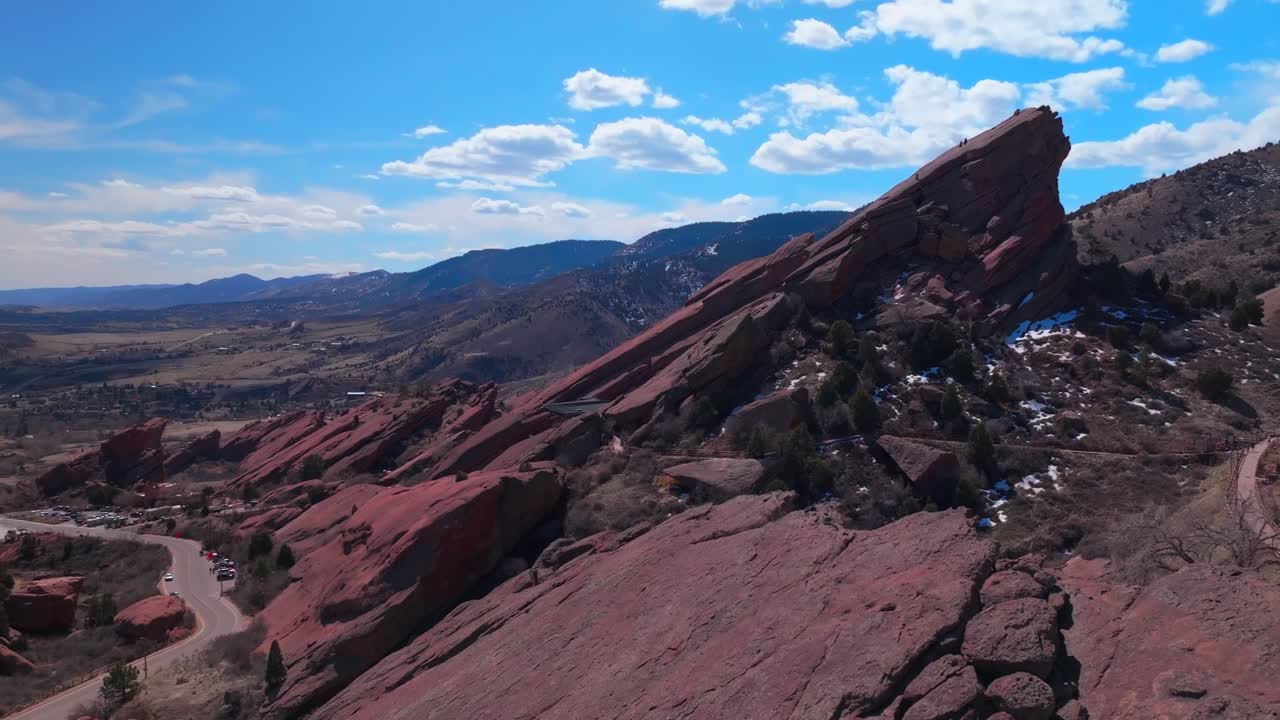 Red Rocks Park and Amphitheater Mount Morrison Colorado aerial drone mid winter windy roads snow covered walking trails Trading Post sunny blue sky clouds stairs tourist destination forward