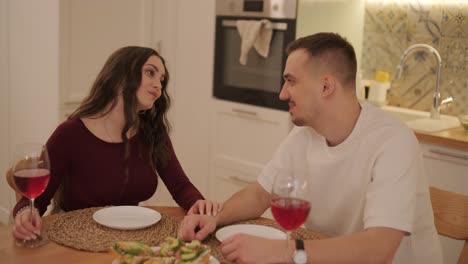 loving couple making a sandwich in kitchen-living room