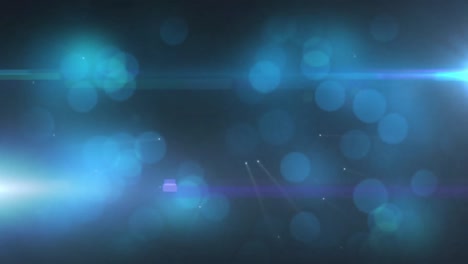 manchas de luz brillantes azules contra un fondo negro