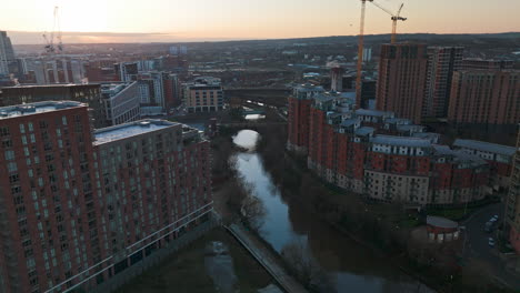 Pullback-Aerial-Drone-Shot-of-Leeds-City-Apartments-at-Sunrise-UK