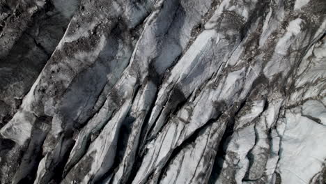 pasterze glacier closeup covered with debris, cracked glacier texture, austria