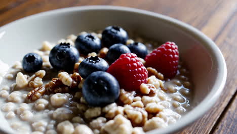 healthy oatmeal with berries and walnuts for breakfast