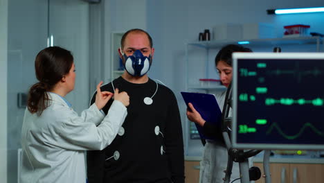 woman researcher preparing patient for endurance test