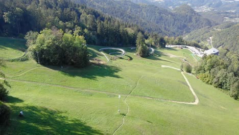 amazing curves of summer toboggan run on green slope