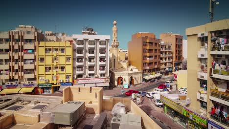 sunny day dubai city deira roof top block panorama 4k time lapse united arab emirates