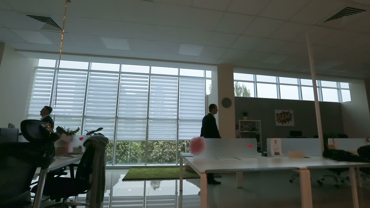 Staff Working In A Busy Office. Open business office with busy staff members