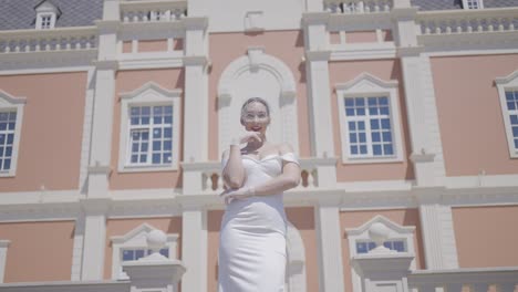 bride in white dress in front of a castle