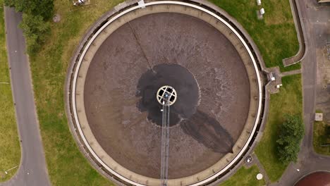 ascending shot view of empty waster water tank at treatment plant