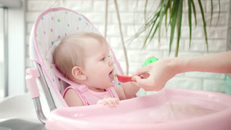 sweet baby girl eating vegetables