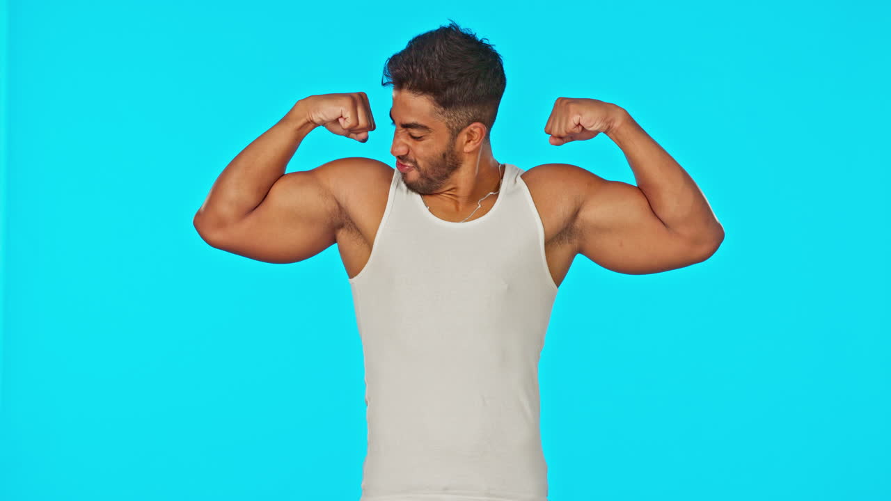 Fitness, blue screen and man flexing muscle