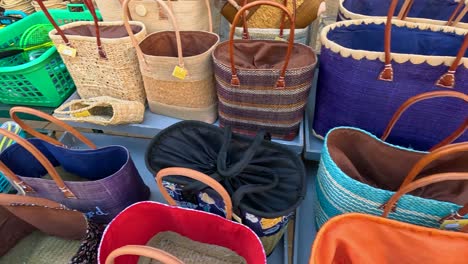 vibrant display of handbags in a market